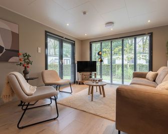 Luxury and new 4p chalet in wooded area on the edge of the Veluwe - Putten - Salon