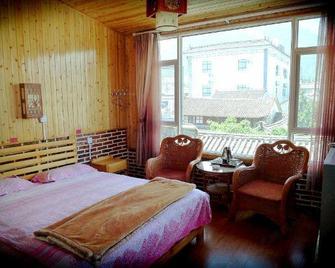 Qian's Hotel - Dali - Bedroom