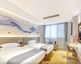 Greentree Eastern Hotel Chizhou Tonghui Plaza - Chizhou - Camera da letto
