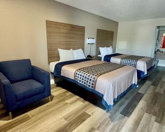 Harrisonville Inn & Suites - Harrisonville - Schlafzimmer