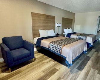 Harrisonville Inn & Suites - Harrisonville - Schlafzimmer