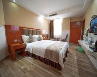 Yi Long Hua Chen Impress Business Hotel - Nanchong - Camera da letto