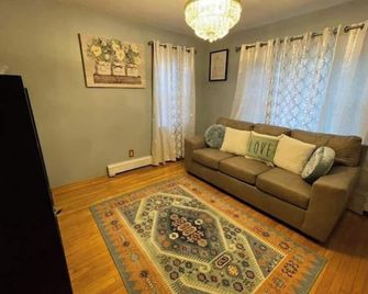 Cheerful 2-Bedroom Home With On Premises Parking - Amityville - Living room