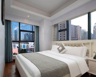 Xiangshuiwan Apartment Hotel (Changsha Wuyi Square Yihao Mansion) - Changsha - Bedroom