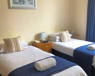 Green Tree Hotel - بيبلز - غرفة نوم