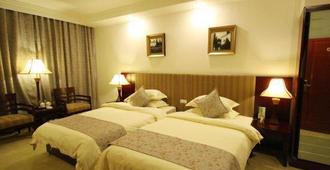 Eclat Business Hotel - Taiyuan - Schlafzimmer