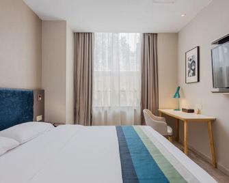 Home Inn Business Hotel (Nanjing Liuhe Xiongzhou Metro Station Jinning Plaza) - Nankín - Habitación