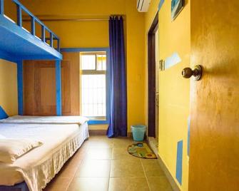 G.T. Guest House - Garapan - Habitación