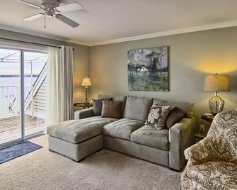 Condo with Lake Charlevoix Views | Private Beach Access | Gas Log Fireplace - Boyne City - Living room
