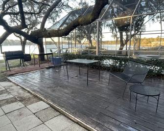 Beach to Bayou Waterfront property with Heated Pool available, Spa, Game Room. - Freeport - Patio