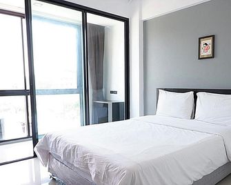 Izen Budget Hotel & Residence - رايونغ - غرفة نوم