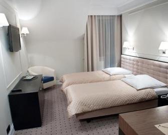 Hotel Focus - لوبلان - غرفة نوم