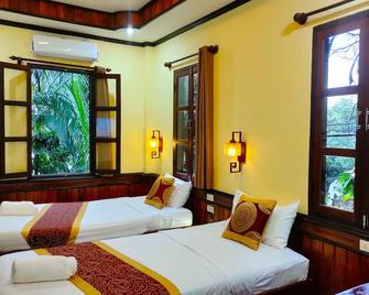 Lotus Corner - Heritage B&B - לואנג פראבאנג - חדר שינה