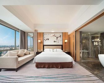 Guilin Jasper International Hotel (Two Rivers and Four Lakes High-tech Wanda Branch) - Guilin - Habitación