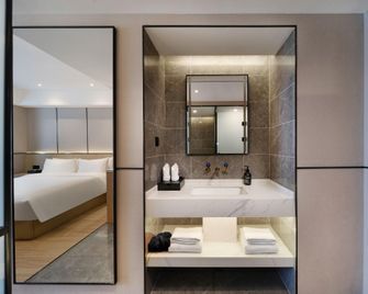 Madison Hotel Zibo Lutai Avenue - Zibo - Спальня