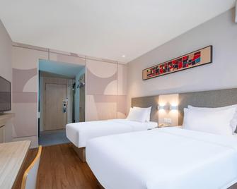 Hanting Hotel Qingdao Taitung Weihai Road - تشينغداو - غرفة نوم