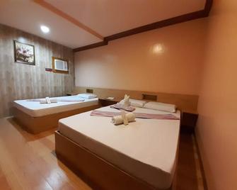 OYO 454 Ging Ging Tourist Inn - Badian - Bedroom