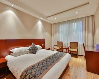 Huayi Hotel - Zhoushan - Schlafzimmer