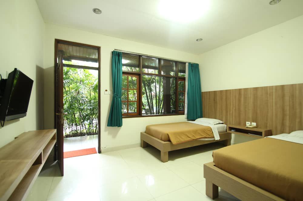 Simpang Inn Hotel - קוטה - חדר שינה