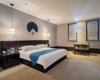 Kangle Mumianwan Hotel - Xuzhou - Bedroom