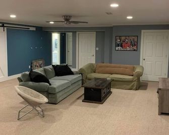 Semi-Private Large Guest Suite; bedroom, bath, and living room in Triad - Kernersville - Living room