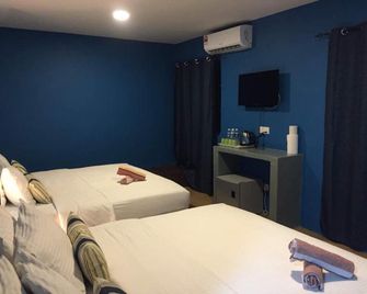 Nu Melati Hotel - Pantai Cenang - Schlafzimmer
