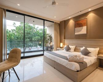 The Lodgers Luxury Hotel Near Golf Course Road Gurgaon - Gurugram - Slaapkamer