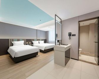 Bofei Hotel (Haikou Meilan International Airport) - Haikou - Slaapkamer
