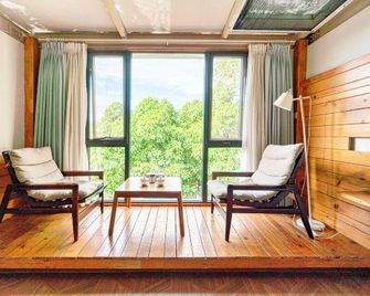 Xichang Shuxia Hotel - Liangshan - Living room
