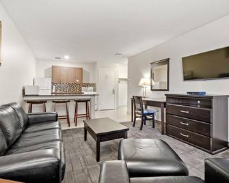 Guest House Inn & Suites - Edson - Sala de estar