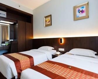 56 Hotel - קוצ'ינג - חדר שינה