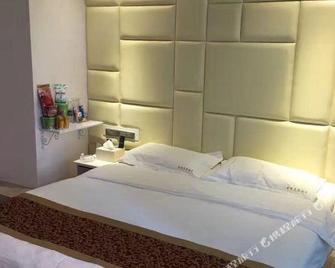 Aili Kesi Hotel - Ляншань - Спальня