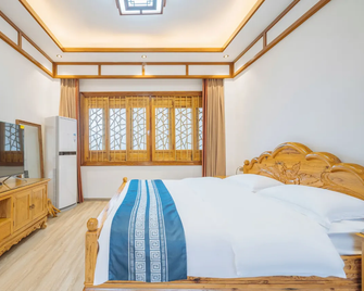 Floral Hotel·Anshun Tunbao hotel (Yunjiu Mountain Branch) - Anshun - Bedroom