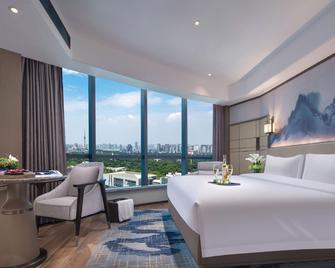 Hunan News International Hotel - Trường Sa - Phòng ngủ