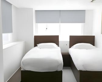 Philstay Myeongdong Central Hotel - Seoul - Schlafzimmer