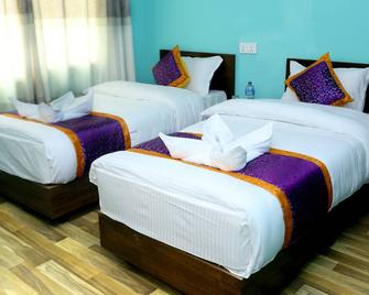 Hotel Rising Home - קטמאנדו - חדר שינה