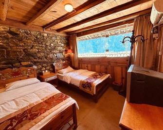 Sean Spring Guesthouse - Lijiang - Bedroom