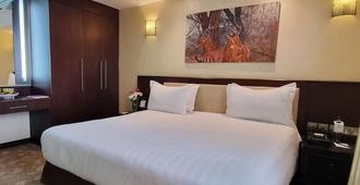 Nairobi Safari Club by Swiss-Belhotel - Nairobi - Bedroom