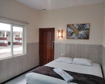 Hotel Arowana - Jember - Slaapkamer