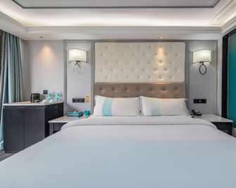 Xana Hotel (Qingdao Business District Shandong Road Branch) - Qingdao - Habitación