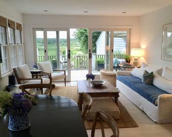 Stunning Waterfront 4 Bedroom Home with Pool, a Dock, an Acre of Land & a Boat - Sag Harbor - Living room