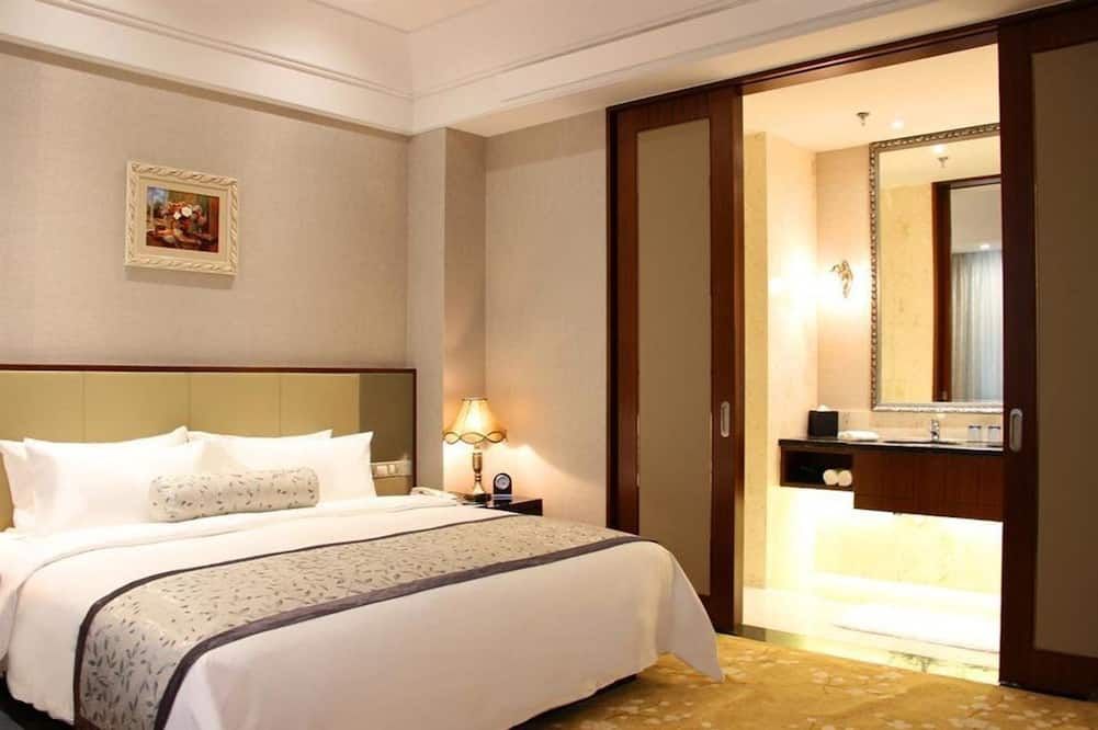 Gloria Grand Hotel Qingdao - تشينغداو - غرفة نوم