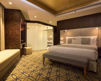 Grand Millennium Muscat - מוסקט - חדר שינה