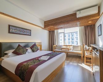 Gurixin Hostel - ליז'יאנג - חדר שינה