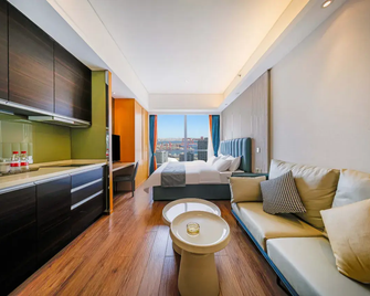 Yue Business Hotel (Dalian Zhongshan Plaza Fulihua International Apartment) - Dalian - Habitación