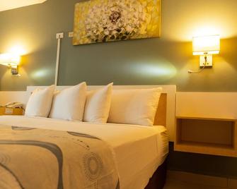 Golden Tree Hotel - Belize Stadt - Schlafzimmer