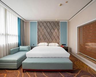Tiancheng Holiday Hotel (Nanchong Renmin Garden) - Nanchong - Bedroom