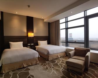 Holiday Inn Taicang City Centre - Suzhou - Schlafzimmer