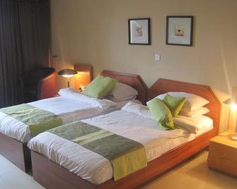 Axari Hotel & Suites - Calabar - Habitación