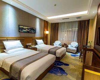Jinhua Hotel - Honghe - Bedroom